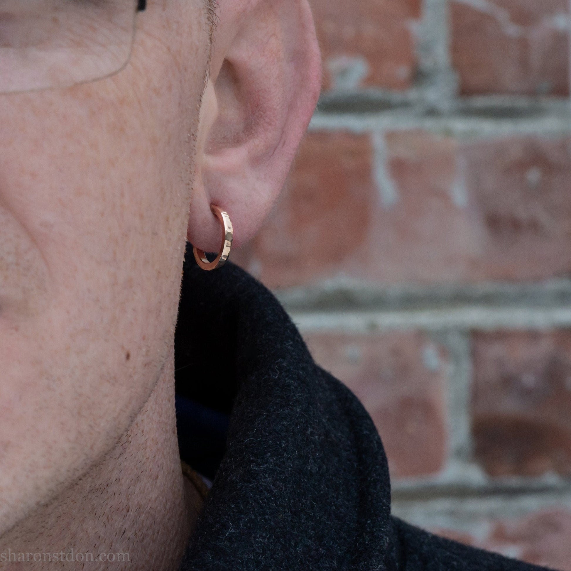 16mm solid gold hoop earrings worn on ear, handcrafted hammered finish 18k/22k yellow gold