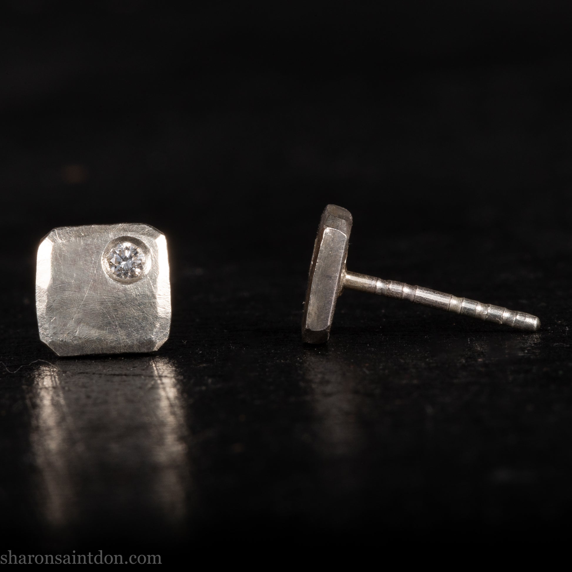 Solid 925 sterling silver stud earrings with lab-grown moissanite, 7mm square, hammered silver with brushed matte finish, corner-set stone, sterling silver posts and backs.