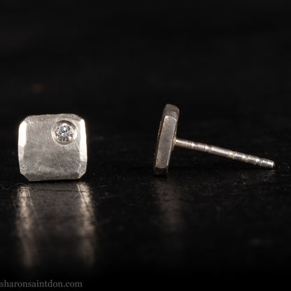 Solid 925 sterling silver stud earrings with lab-grown moissanite, 7mm square, hammered silver with brushed matte finish, corner-set stone, sterling silver posts and backs.