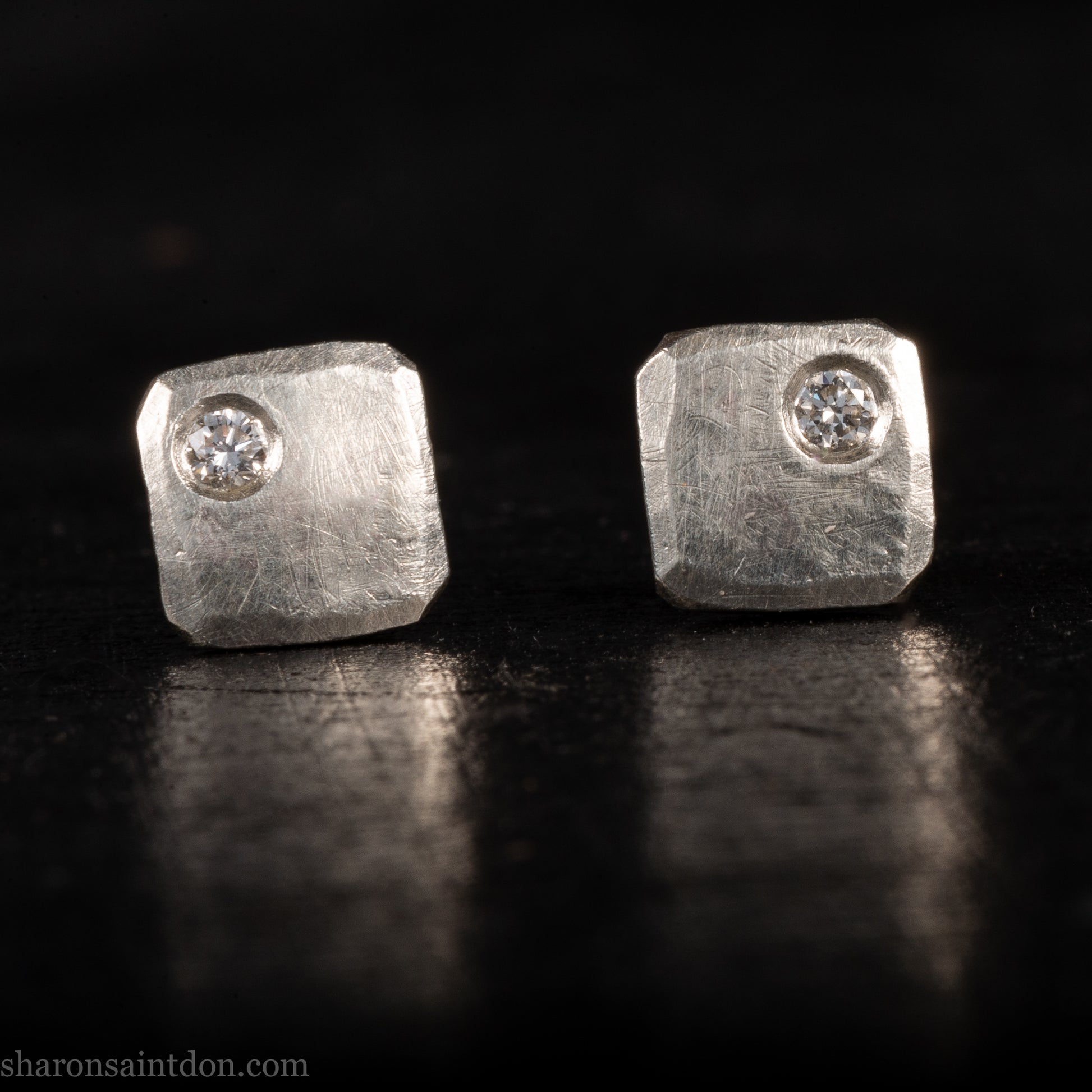 Solid 925 sterling silver stud earrings with lab-grown moissanite, 7mm square, hammered silver with brushed matte finish, corner-set stone, sterling silver posts and backs.