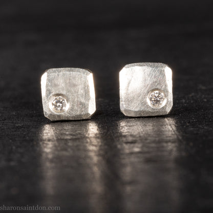 Solid 925 sterling silver stud earrings with lab-grown moissanite, 7mm square, hammered silver with brushed matte finish, corner-set stone, sterling silver posts and backs.