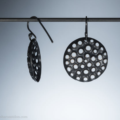 25mm solid 925 sterling silver round disc earrings, hand-punched pattern, flat matte black oxidized finish.