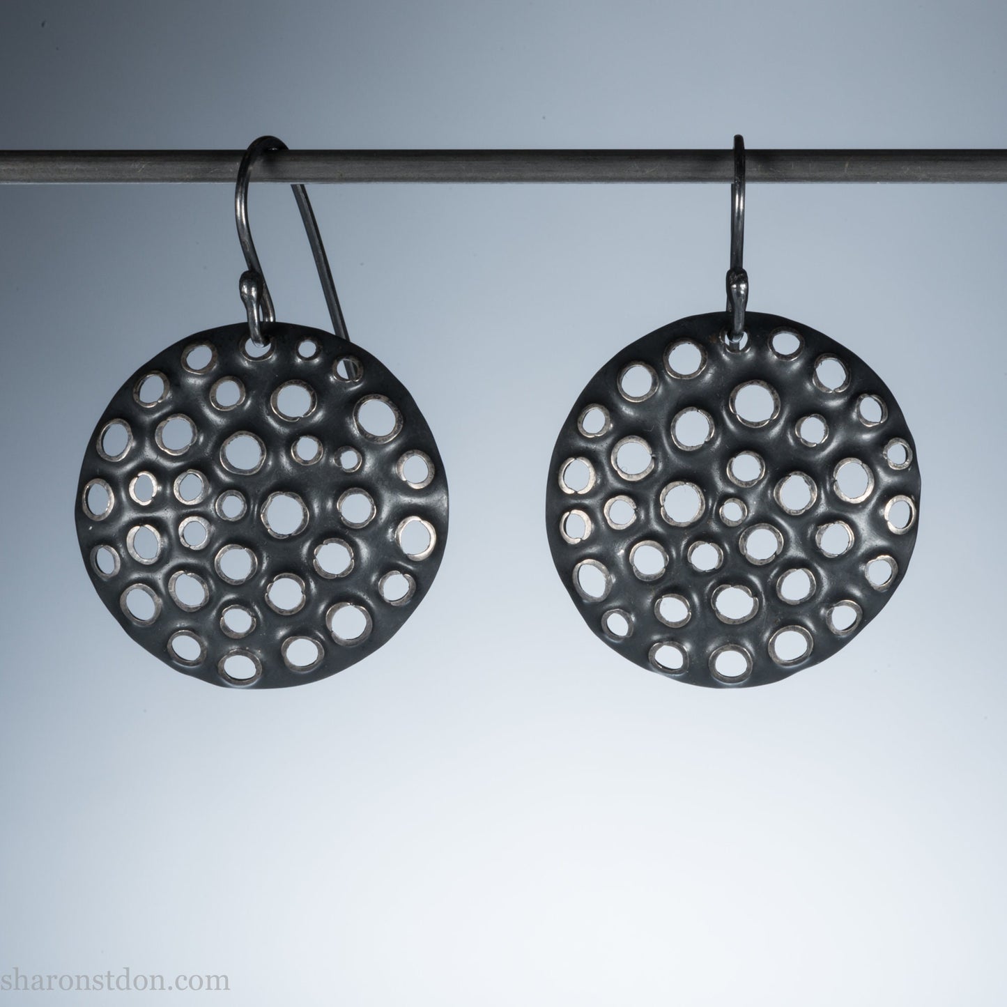 25mm solid 925 sterling silver round disc earrings, hand-punched pattern, flat matte black oxidized finish.
