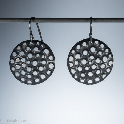 25mm solid 925 sterling silver round disc earrings, hand-punched pattern, flat matte black oxidized finish.
