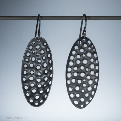38mm solid 925 sterling silver oval disc earrings, hand-punched pattern, flat matte black oxidized finish, handmade ear wires.