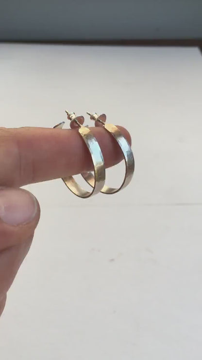 Handmade 925 sterling silver hoop earrings. Comfortable, lightweight, daily wear earrings hammered by hand from solid sterling silver. 30mm diameter, 4 mm wide, 1mm thick. Brushed, matte shiny surface.