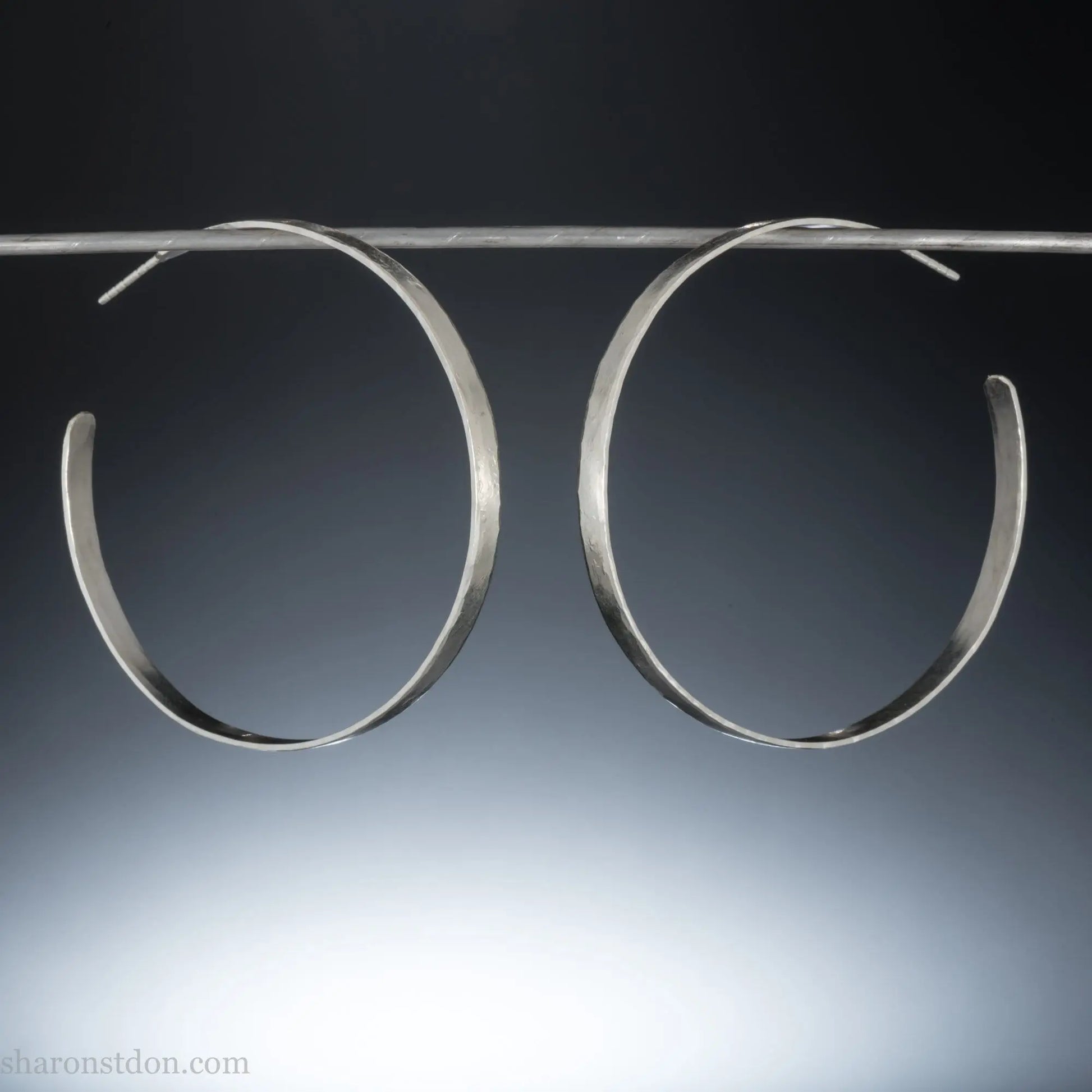 55mm sterling silver hoop earrings with hammered texture and matte brushed finish.