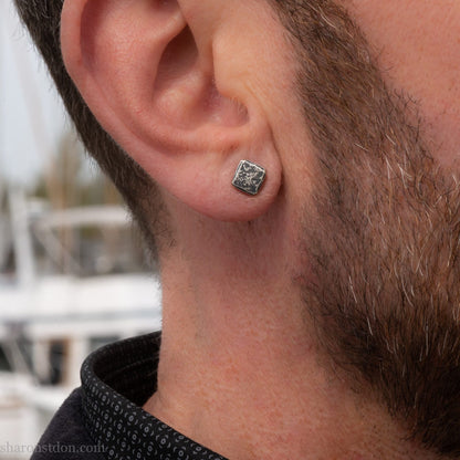 7mm square solid 925 sterling silver stud earrings, dark antique finish, on ear of man with beard.