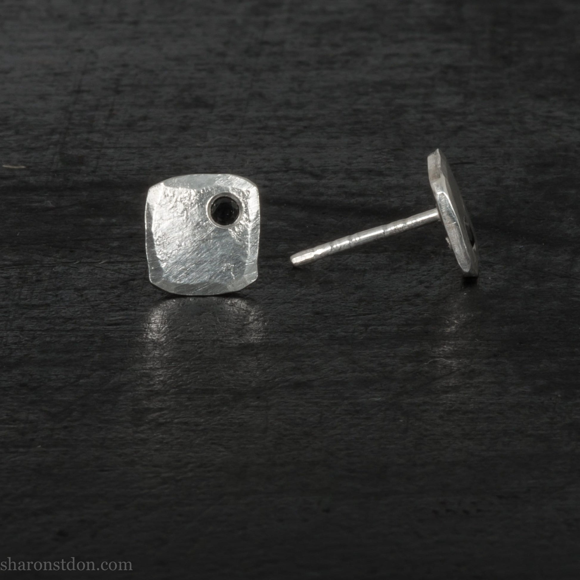 Black spinel stud earrings in sterling silver, 7mm square with matte finish.