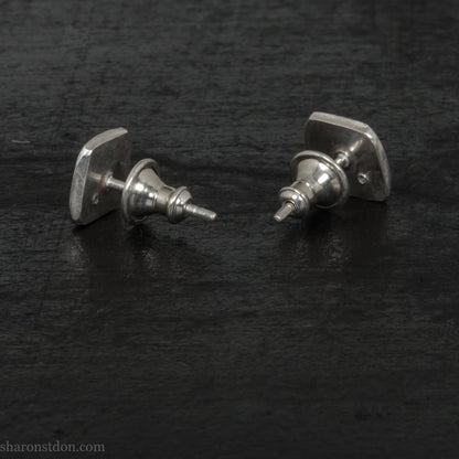 Black spinel stud earrings in sterling silver, 7mm square with matte finish.