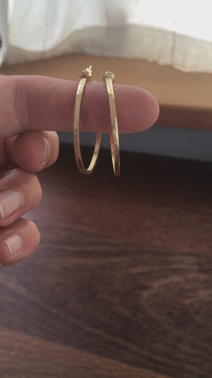 30mm diameter solid 18k gold hoop earrings 2mm wide, 1.5mm thick. Handmade hammered texture high quality earrings with solid 18k gold posts and 14k backs.