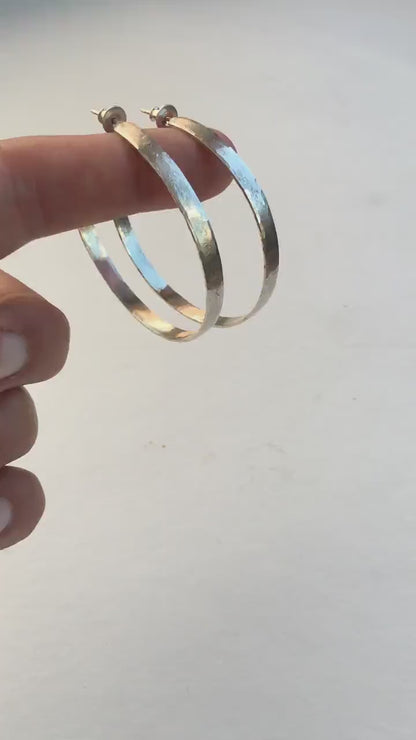 55mm sterling silver hoop earrings with hammered texture and matte brushed finish.