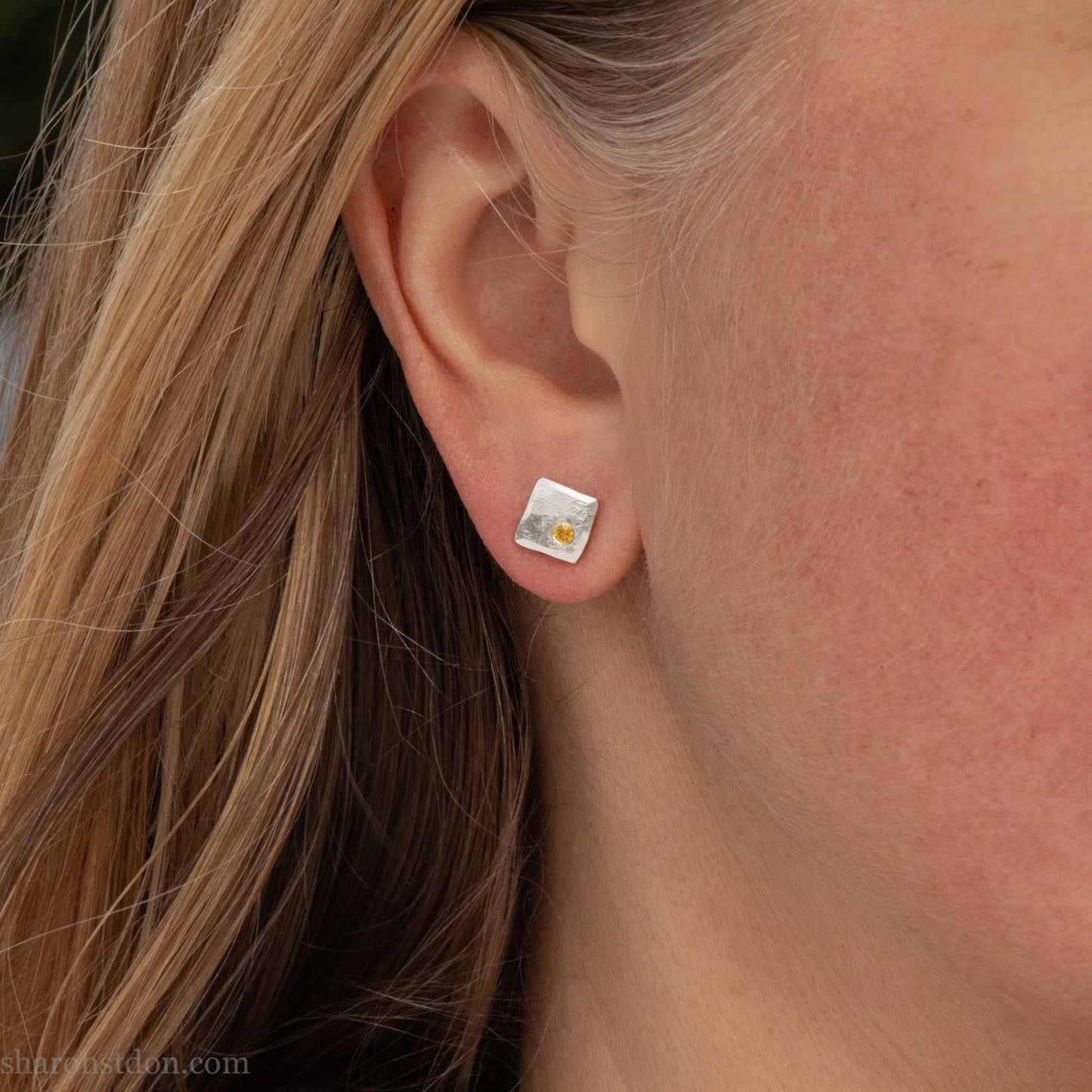 925 sterling silver square stud earrings with lab grown golden yellow topaz gemstones. 925 sterling silver handmade by Sharon SaintDon in North America. 7mm x 7mm, 1.5 thick with 2mm round flush set stone in corner. Silver posts and backs.