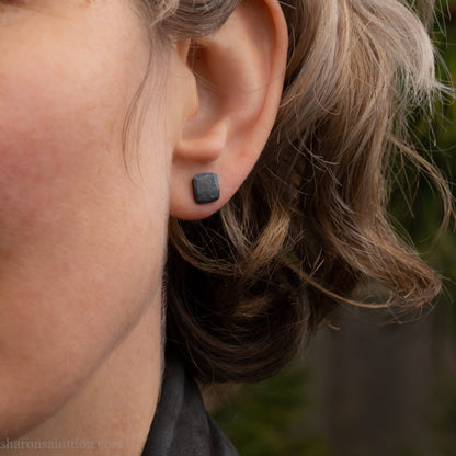 925 sterling silver stud earrings.  7mm square, hammered solid silver, oxidized black with silver posts and backs. Handmade by Sharon SaintDon in North America.