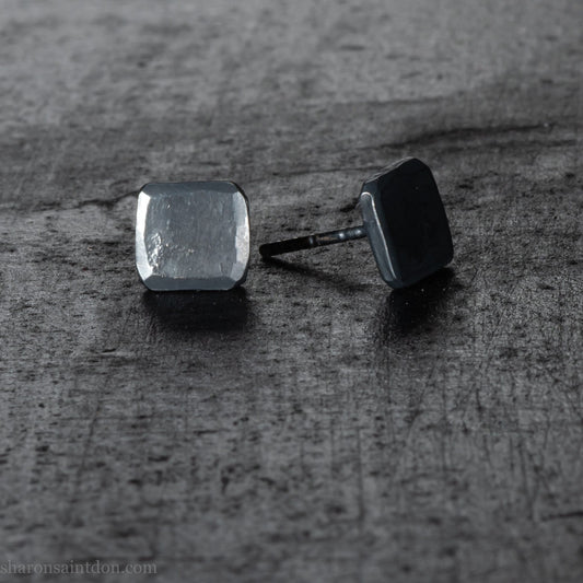 925 sterling silver stud earrings.  7mm square, hammered solid silver, oxidized black with silver posts and backs. Handmade by Sharon SaintDon in North America.