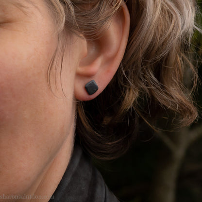 925 sterling silver stud earrings.  7mm square, hammered solid silver, oxidized black with silver posts and backs. Handmade by Sharon SaintDon in North America.