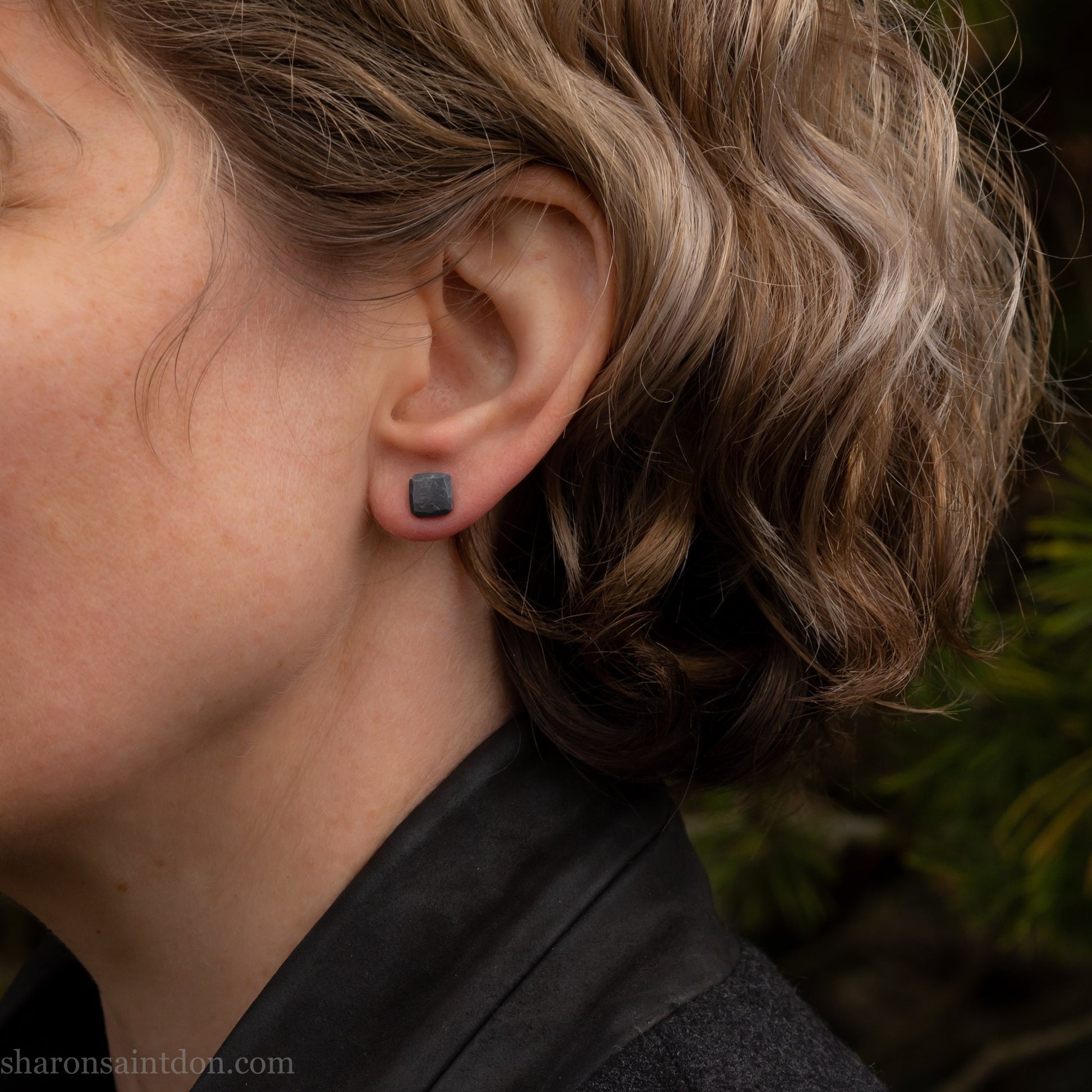 
925 sterling silver stud earrings.  7mm square, hammered solid silver, oxidized black with silver posts and backs. Handmade by Sharon SaintDon in North America.