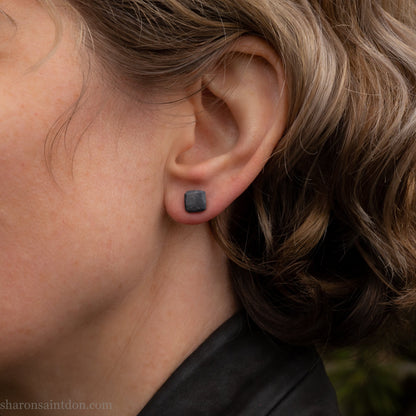 925 sterling silver stud earrings.  7mm square, hammered solid silver, oxidized black with silver posts and backs. Handmade by Sharon SaintDon in North America.