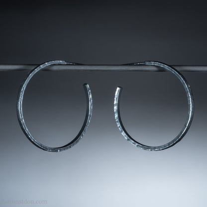 Oxidized black sterling silver hammered round hoop earrings. 30mm diameter, 2mm wide, solid hammered silver.