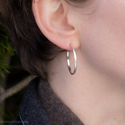 Handmade 925 sterling silver hoop earrings. Comfortable, lightweight, Handmade solid 925 sterling silver hoop earrings. 30mm diameter, 2mm wide, 1.5 thick. Silver posts and backs. Hammered by Sharon SaintDon in North America.