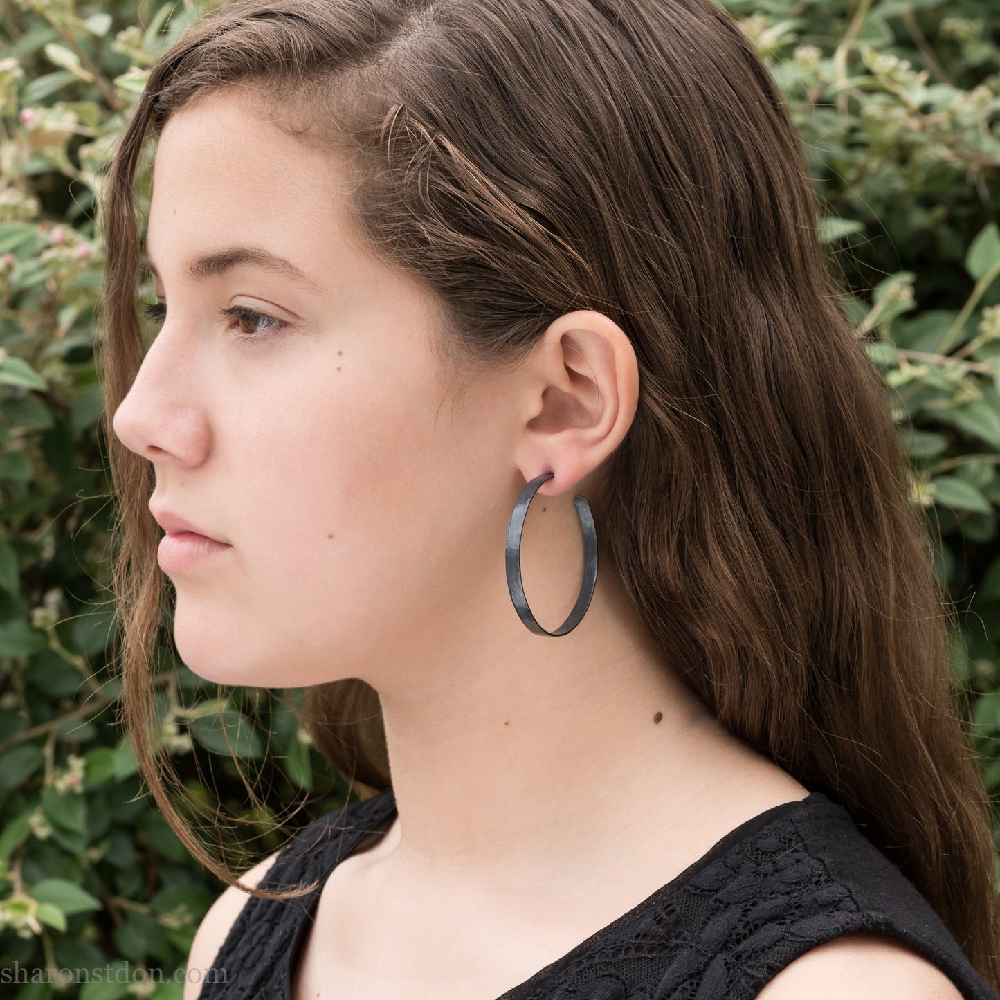 Handmade 925 sterling silver hoop earrings for women. Oxidized black, lightweight large hoop earrings handmade and hammered by Sharon SaintDon in the Pacific Northwest of the USA. 50mm diameter, 5mm wide.