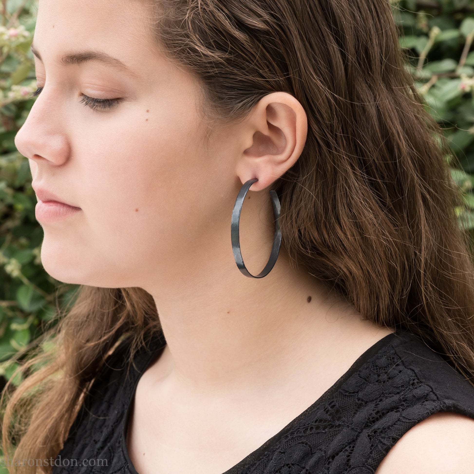 Handmade 925 sterling silver hoop earrings for women. 55mm diameter, 5mm wide, Oxidized black, large hoops for daily wear. Minimalist, comfortable, lightweight with a hammered, texture.