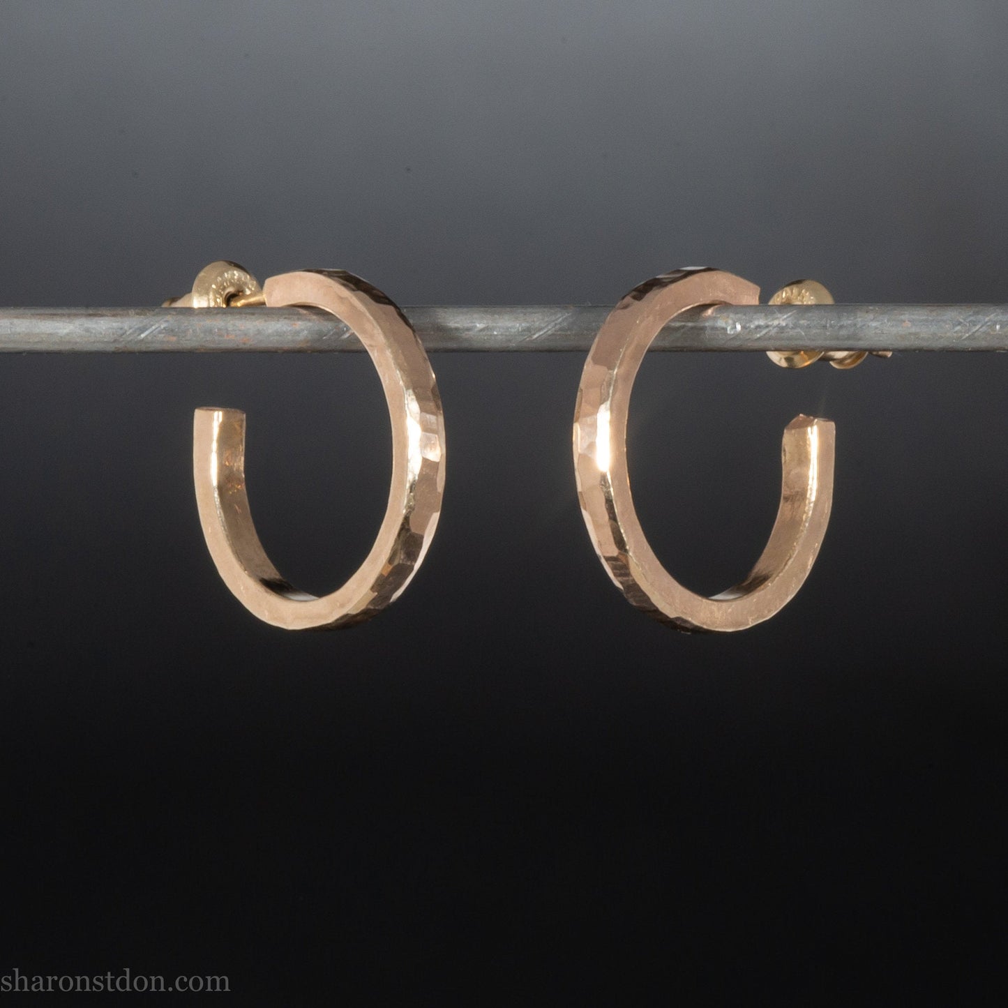 Solid 18k yellow gold hoop earrings set, handmade in North America by Sharon SaintDon.18mm diameter round, 2mm wide, 1.5mm thick, with hammered texture and matte finish.