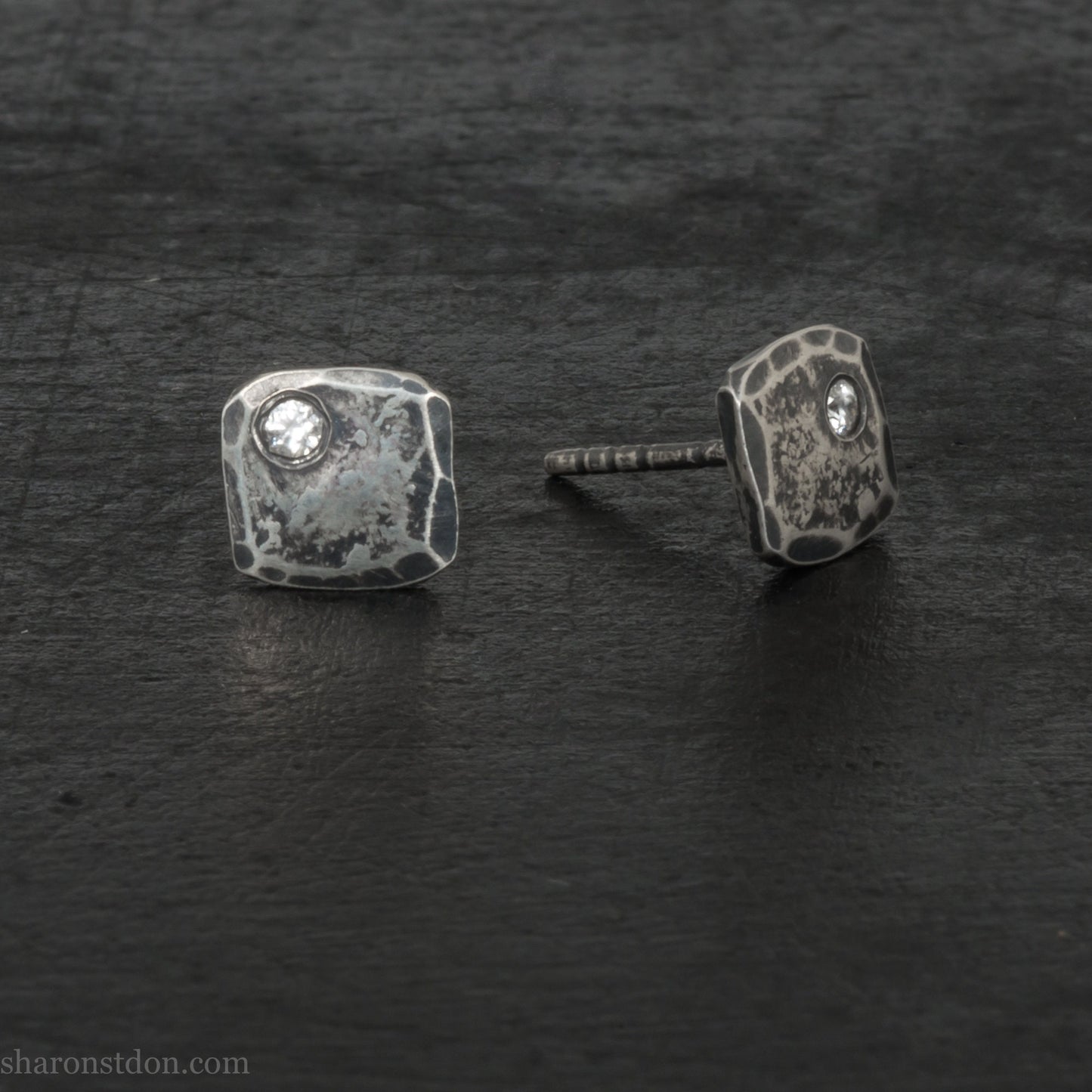 7mm square, handmade 925 sterling silver stud earrings with Canadamark brand Canadian diamond in the corner. Dark, antique finish, Handmade by Sharon SaintDon in North America.