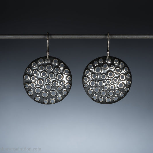 Handmade 925 sterling silver dangle earrings for women. Round disc earrings with perforated holes made by Sharon SaintDon in North America.