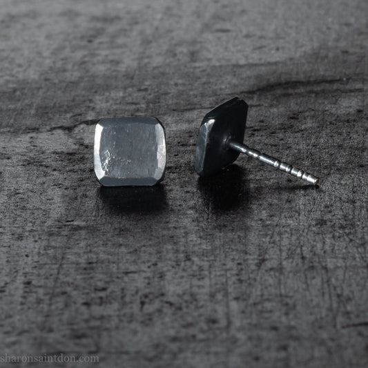 Handmade 925 sterling silver stud earrings.  Small hammered, textured squares. Minimalist, oxidized black stud earrings for men or women made by Sharon SaintDon in North America.
