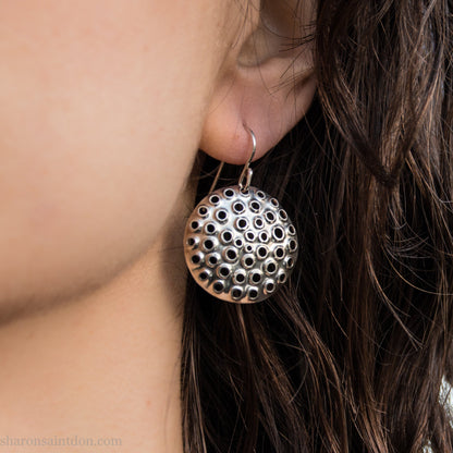 Handmade 925 sterling silver earrings for women. Round disc earrings with perforated holes made by Sharon SaintDon in North America. 25mm diameter.