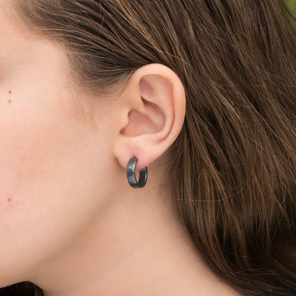Black 925 sterling silver hoop earrings for men or women, non binary. 16mm x 4mm, thick, hammered solid silver. Handmade in the USA by Sharon SaintDon.