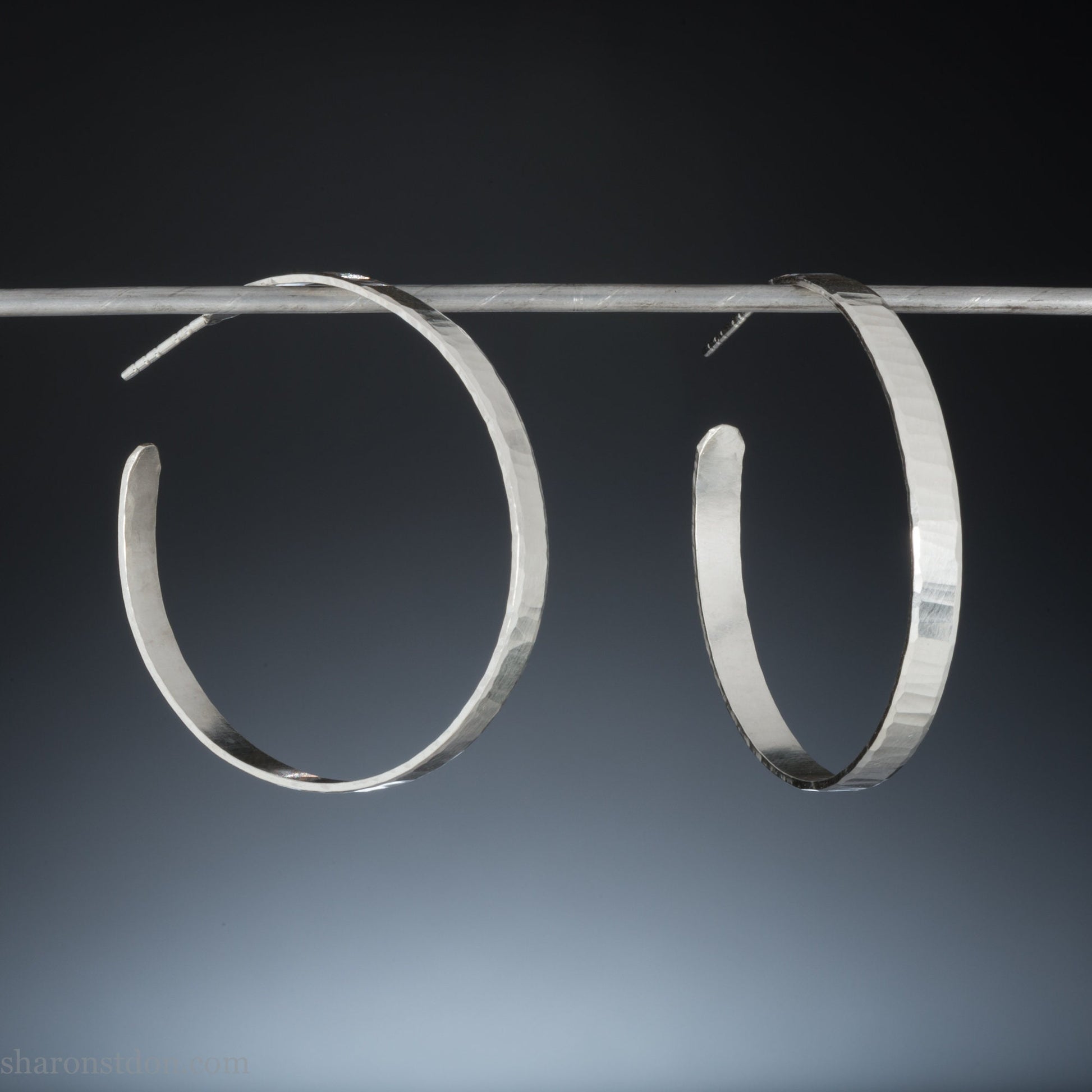 925 handmade sterling silver hoop earrings for women. Comfortable, lightweight, daily wear earrings with a hammered, wavy texture.
