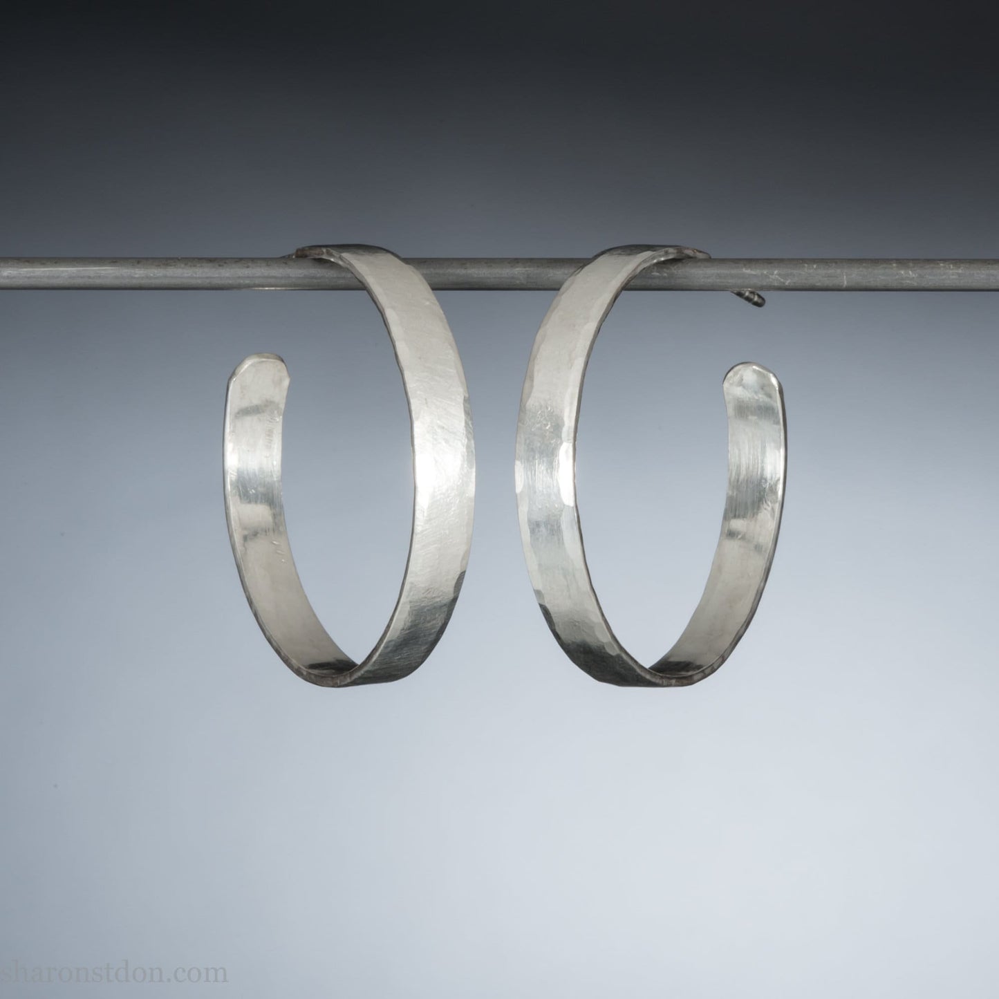Handmade 925 sterling silver hoop earrings for women. Comfortable, lightweight, daily wear earrings with a hammered texture.
