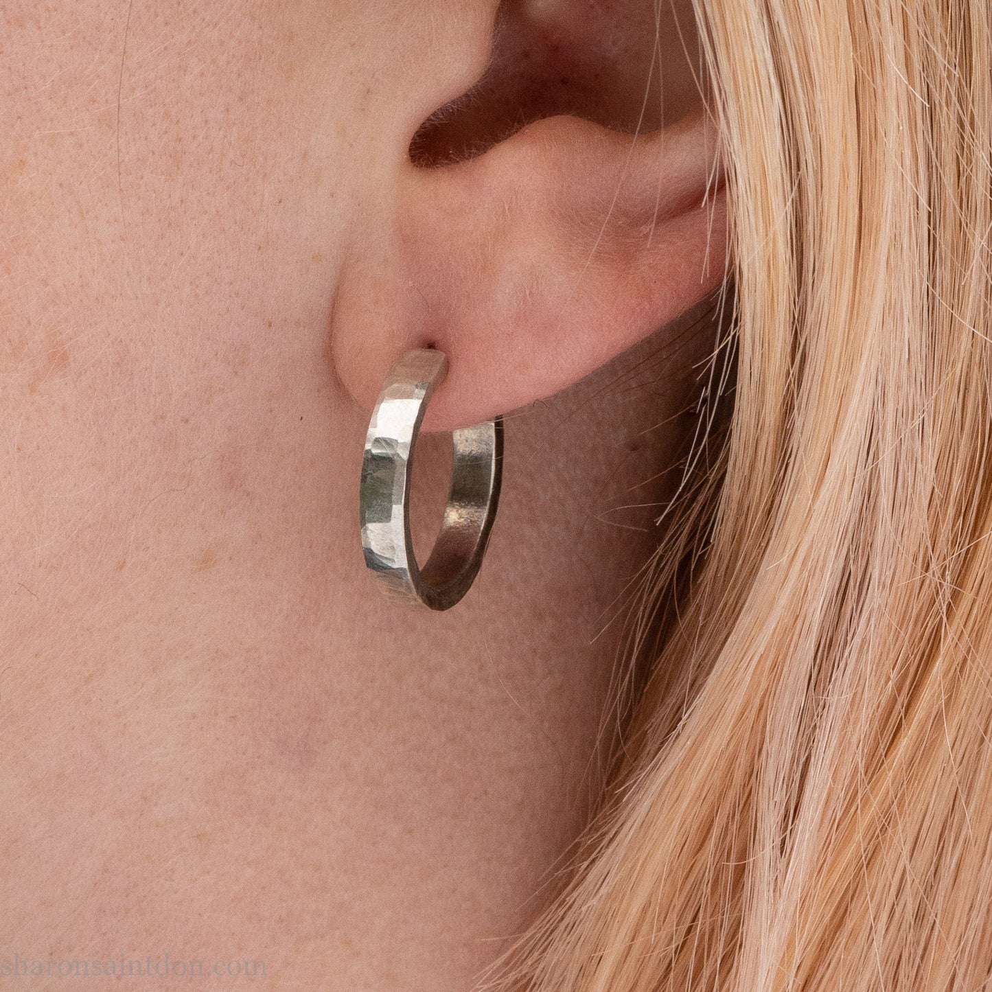 925 sterling silver hoop earrings handmade in North America by Sharon SaintDon. Small, round with hammered texture.