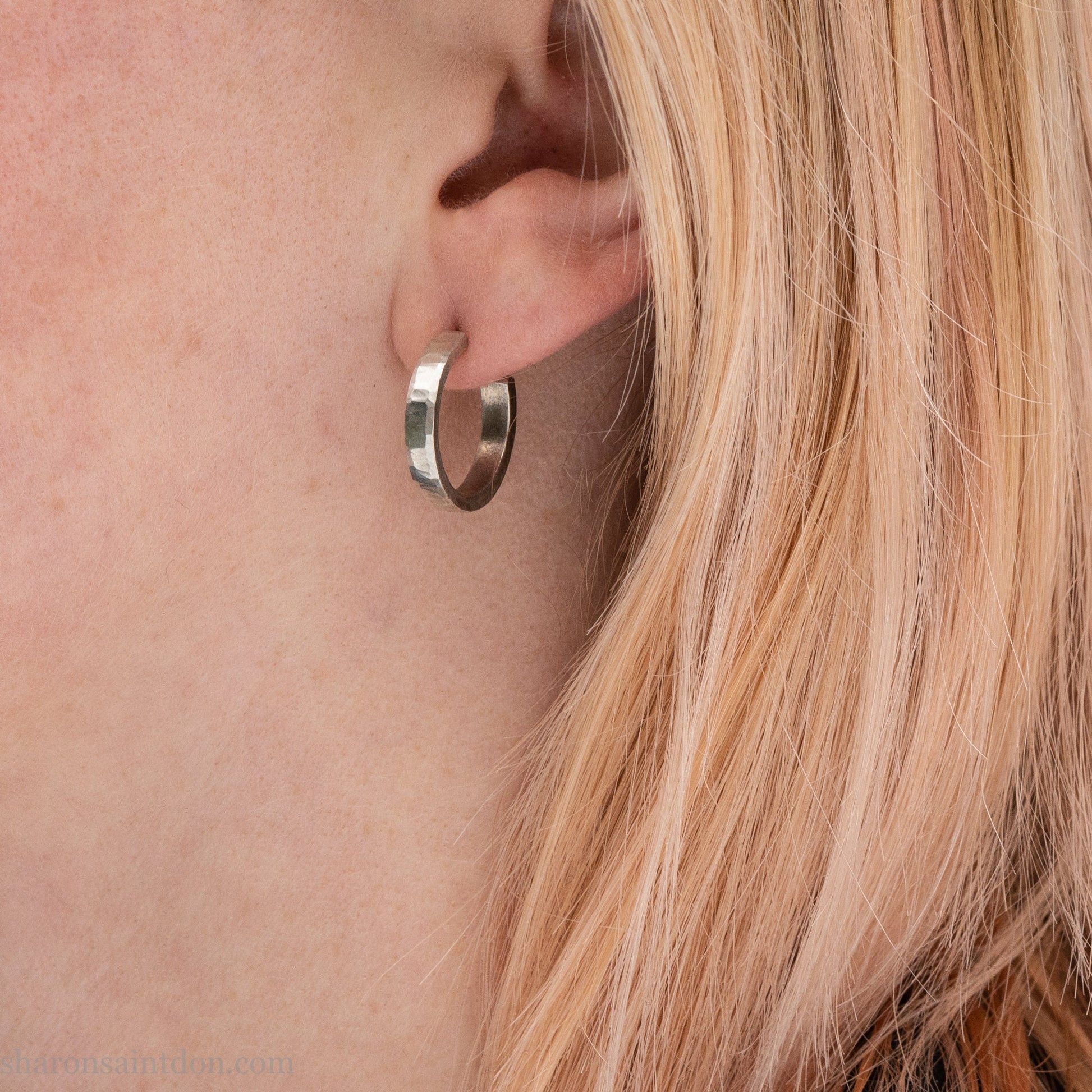 925 sterling silver hoop earrings handmade in North America by Sharon SaintDon. Small, round with hammered texture.