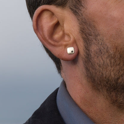 7mm square 925 sterling silver stud earrings with a black spinel gemstone in the corner. Hammered texture with a matte, brushed, shiny finish. Handmade by Sharon SaintDon in North America for men or women.