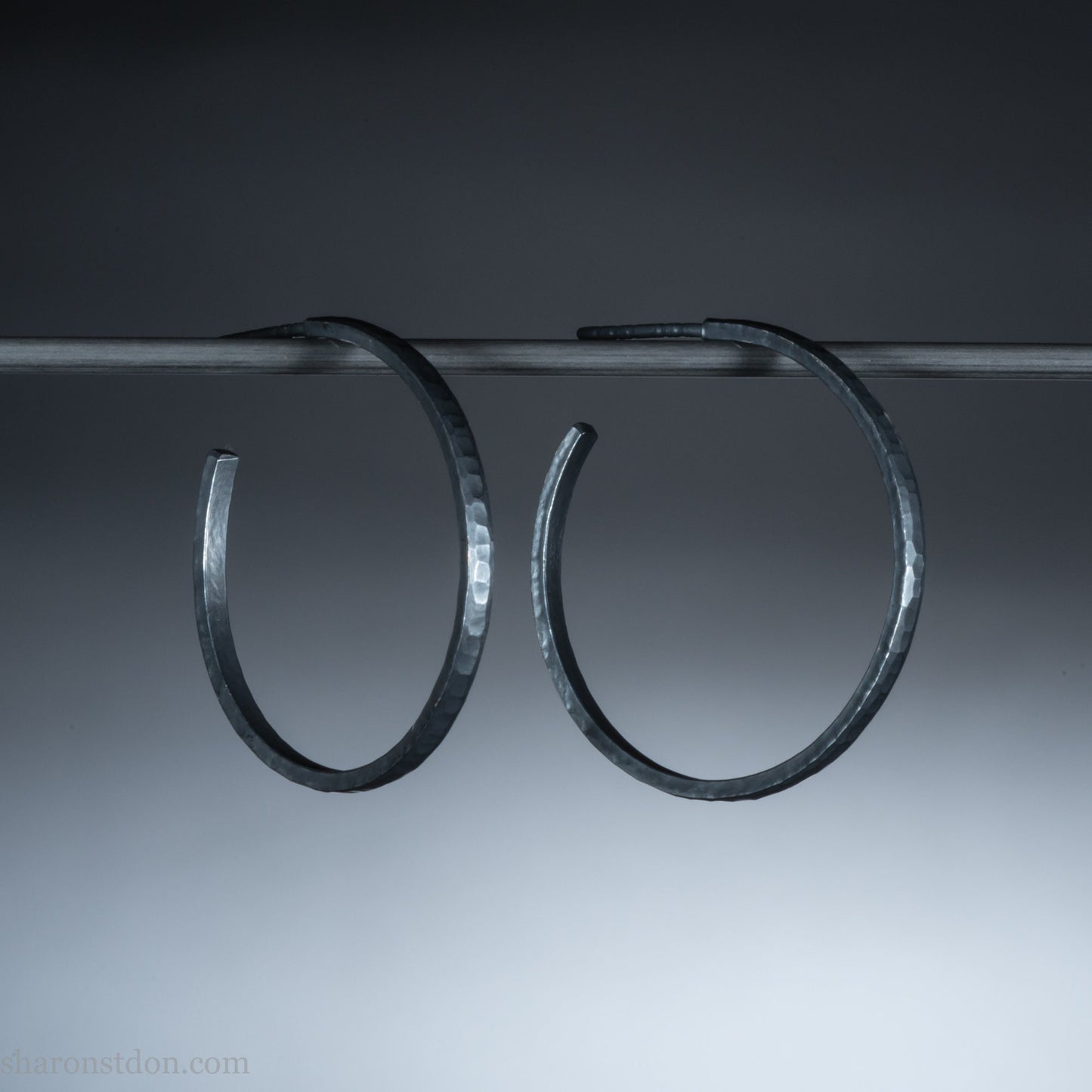 25mm oxidized black sterling silver round hammered hoop earrings.