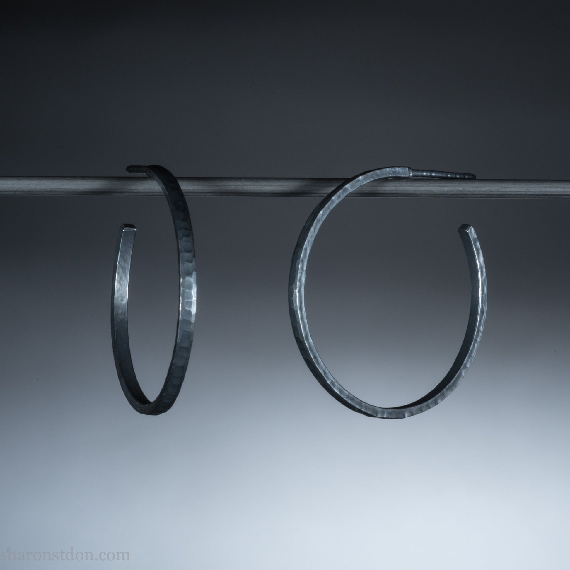 25mm oxidized black sterling silver round hammered hoop earrings.