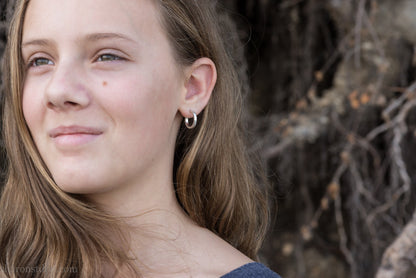 Small sterling silver hoop earrings, 16mm diameter, 2mm wide, hammered solid silver with brushed matte finish, sterling silver posts and backs.