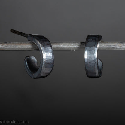 Hammered solid 925 silver hoop earrings with an oxidized black finish. 12mm Small black oxidized sterling silver hoop earrings 12mm - handmade hammered texture hoop earrings.