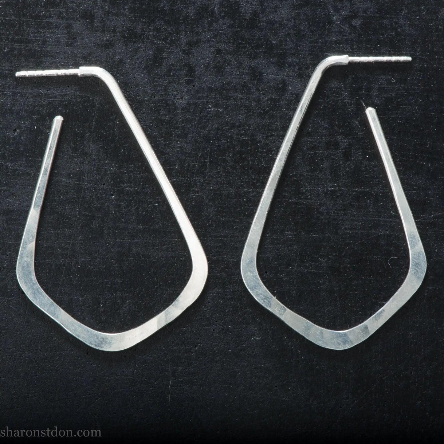 Sterling silver teardrop elongated shape hoop earrings, hammered matte finish, 50x32mm.