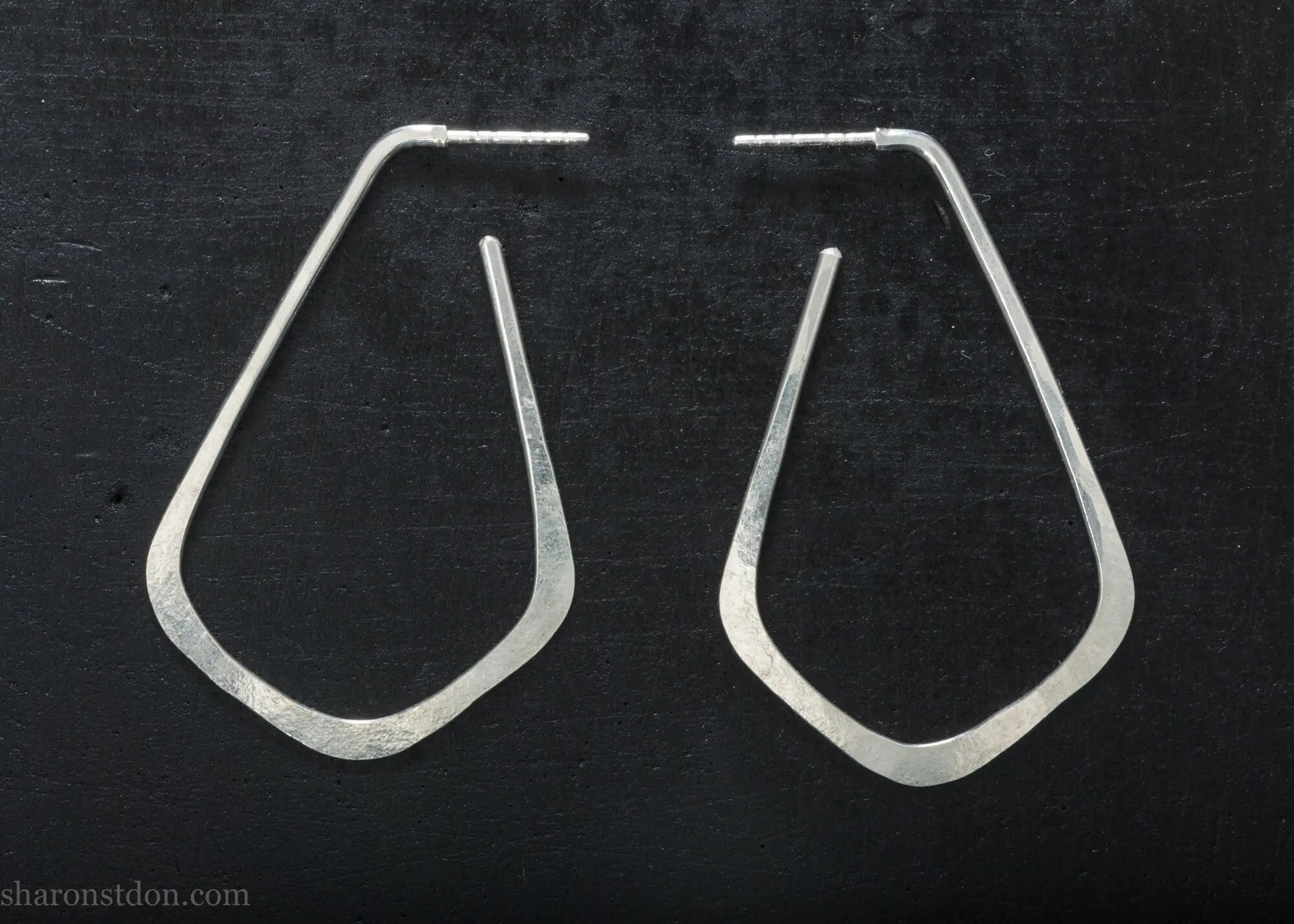 Sterling silver teardrop elongated shape hoop earrings, hammered matte finish, 50x32mm.