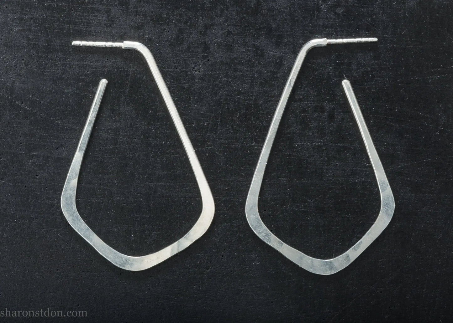 Sterling silver teardrop elongated shape hoop earrings, hammered matte finish, 50x32mm.