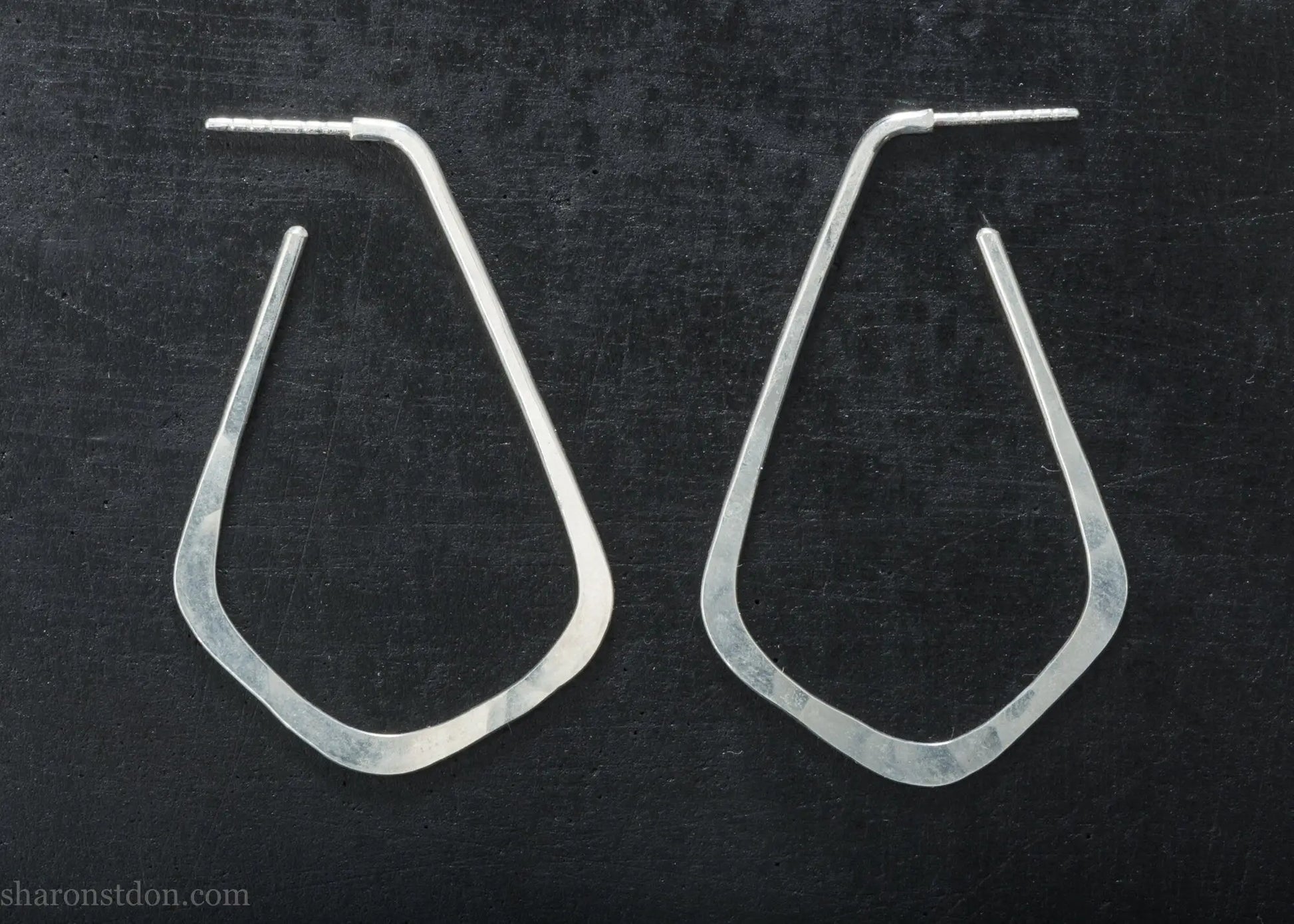 Sterling silver teardrop elongated shape hoop earrings, hammered matte finish, 50x32mm.