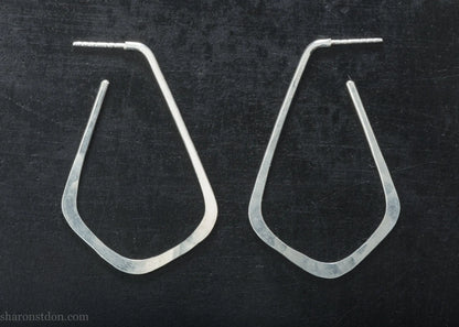 Sterling silver teardrop elongated shape hoop earrings, hammered matte finish, 50x32mm.